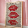 Framed canvas art featuring a vintage newspaper style image of red lips.