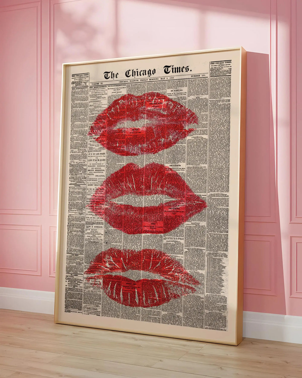 Framed canvas art featuring a vintage newspaper style image of red lips.