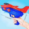 A hand holds a red and blue foam catapult glider plane toy set against a light blue background.