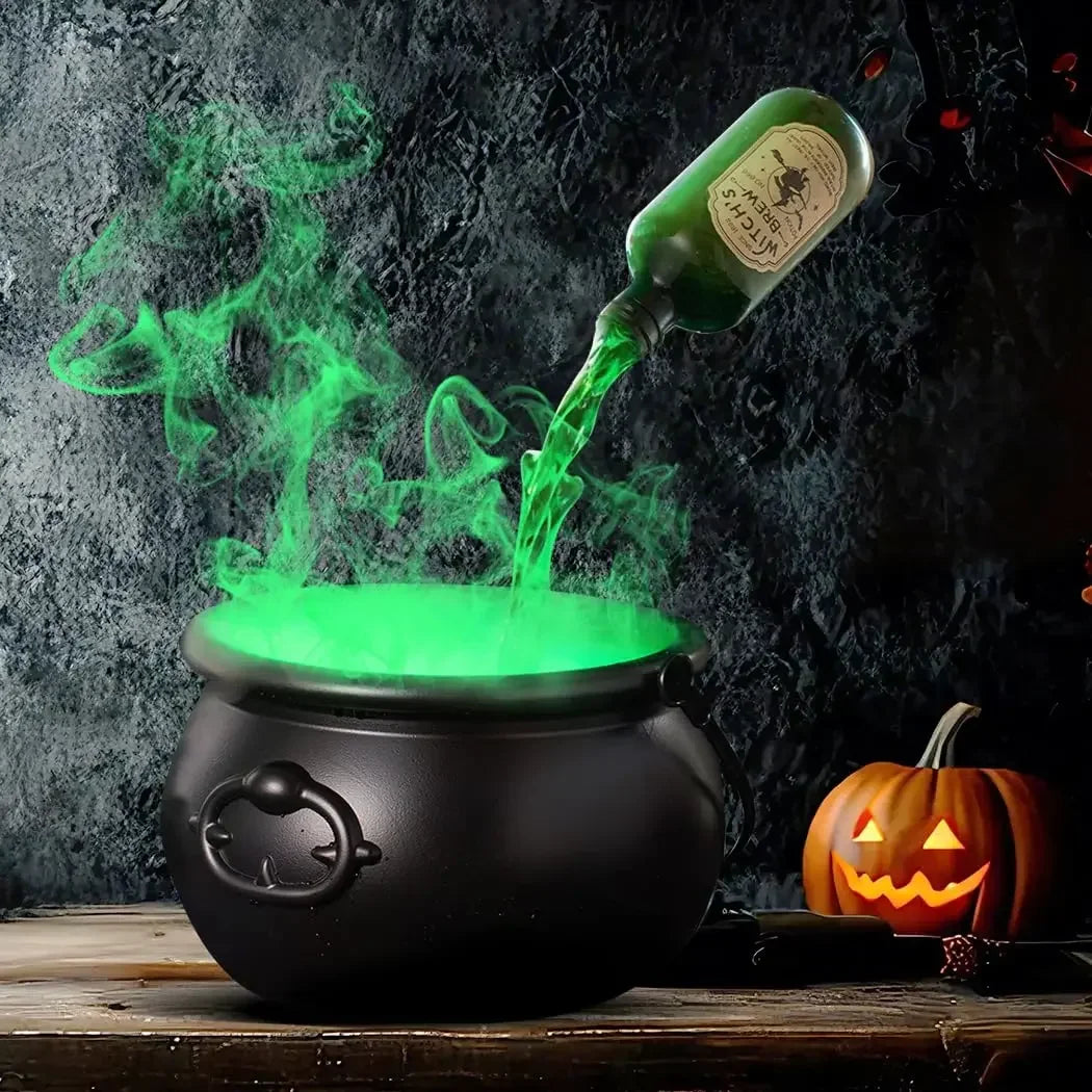 A dark cauldron emits a green fog mist with a floating potion effect against a dark background.