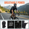 A man wearing a black breathable balaclava cap while cycling on a scenic mountain road.