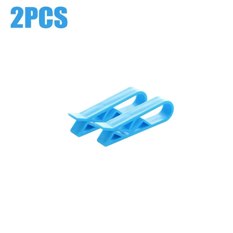 Two blue plastic clips designed to hold garbage bags or snack bags on trash cans.