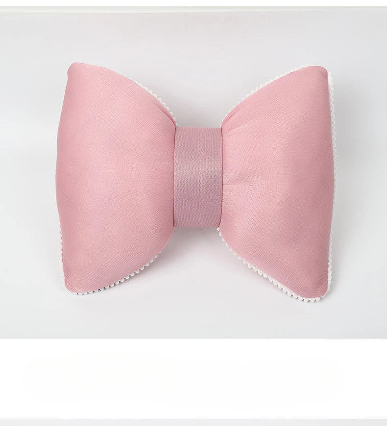 A pink silky bow car headrest pillow with a waist cushion set.