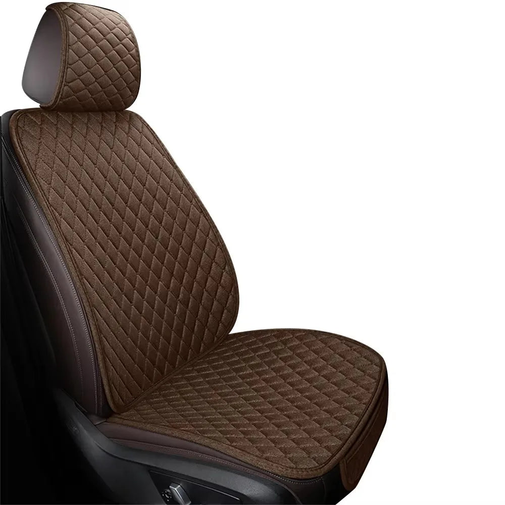 A close-up view of a dark brown quilted car seat cover set.