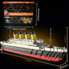 A detailed model of a Titanic ship built from building blocks, shown in profile view.