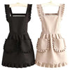 A black Korean style cotton kitchen apron with adjustable neck strap and pleated details.