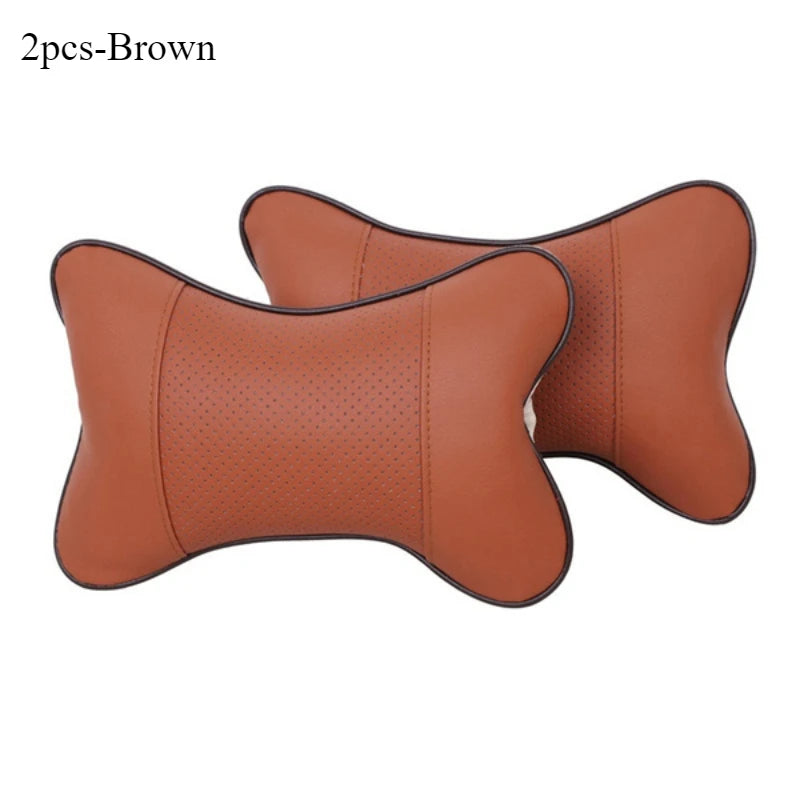 Two brown leather knitted car neck pillows shown side by side.