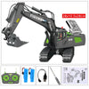 A remote controlled excavator toy set with a yellow and black body, attached to a green and black remote controller and acces