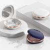 A set of compact orthodontic retainer cases featuring built-in mirrors and storage compartments in white and rose gold tones.