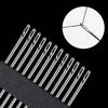 A close-up view of stainless steel self-threading sewing needles against a black background.