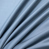 Soft blue luxury bamboo flat sheet fabric draped in flowing folds