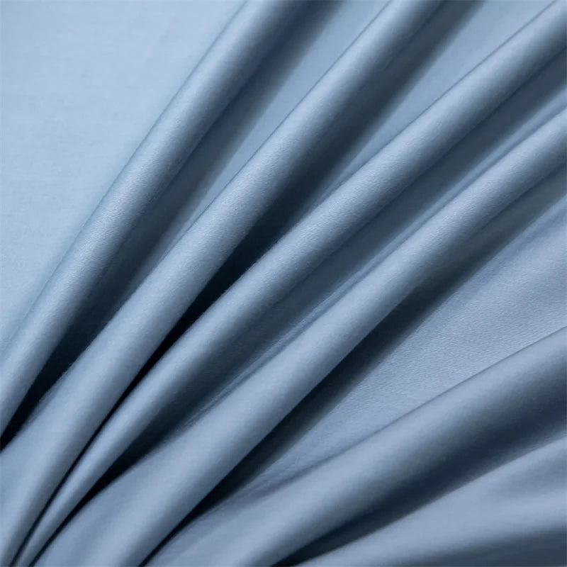 Soft blue luxury bamboo flat sheet fabric draped in flowing folds