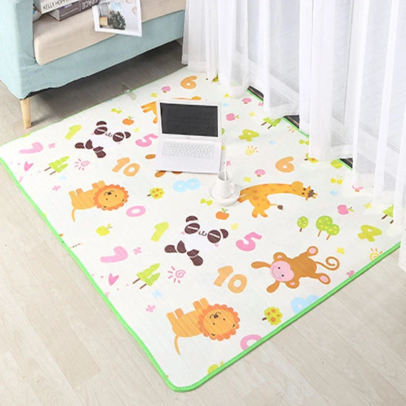 A colorful play mat featuring animal shapes and numbers for baby play on a floor.