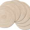 A set of six round, beige braided placemats stacked and arranged on a surface.