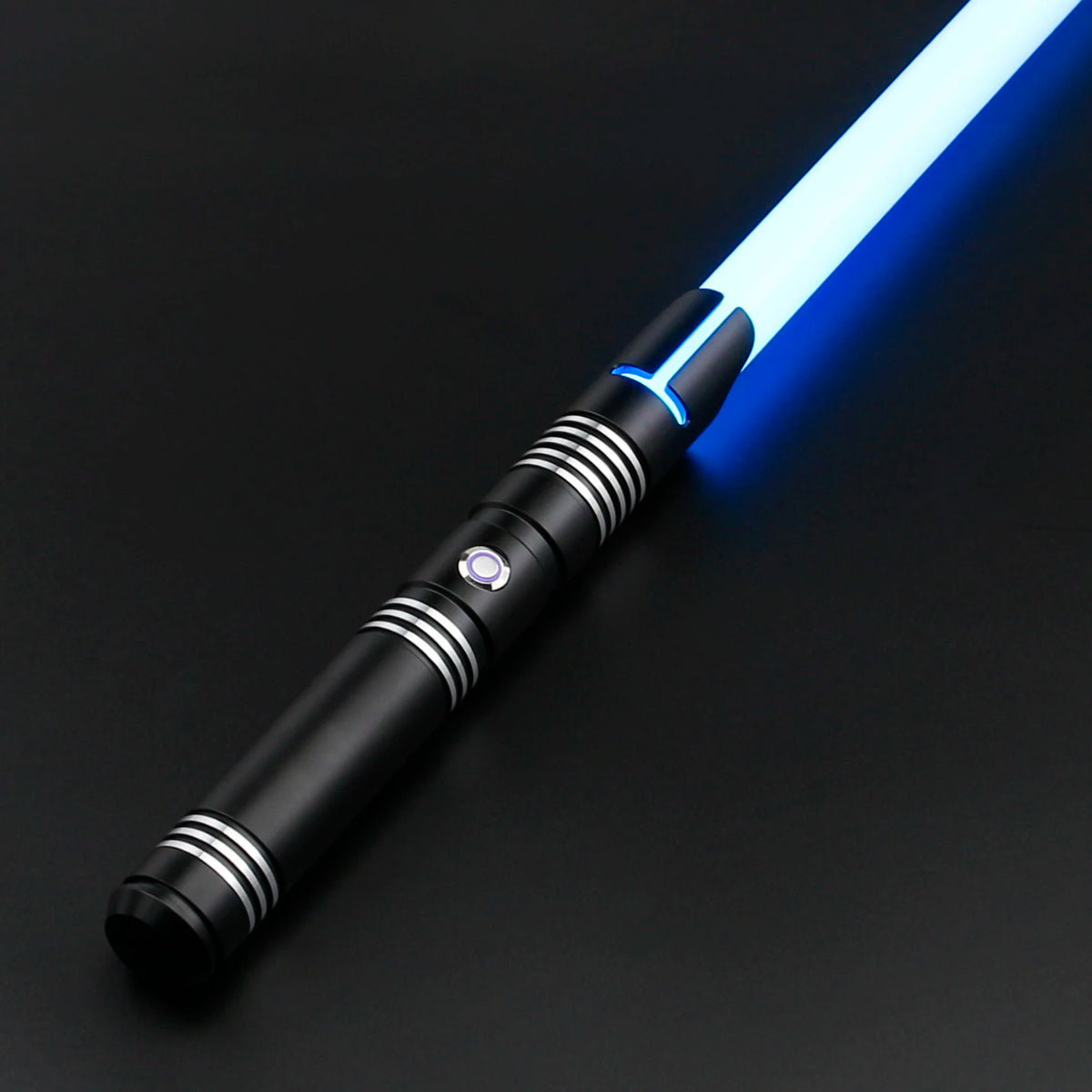 A black lightsaber with a glowing blue blade is shown diagonally on a dark surface.