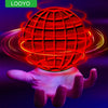 A glowing red sphere is held by a hand, surrounded by bright light trails, demonstrating an LED flying spinner toy.
