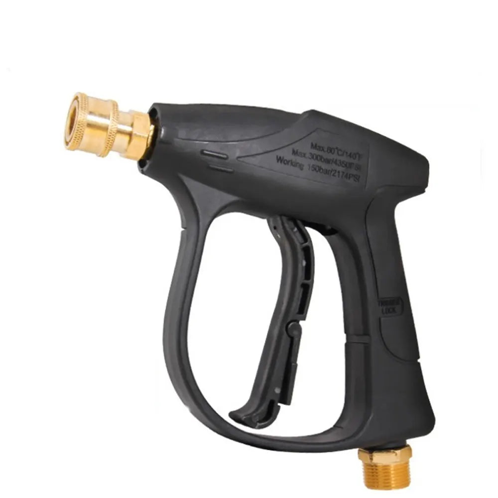 Black high-pressure car wash gun with a brass nozzle and a gold-colored spray tip.