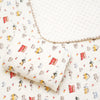 A white cotton gauze baby swaddle blanket with an adorable bear print pattern.