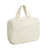 A cream-colored quilted portable hanging toiletry bag with fabric handles.