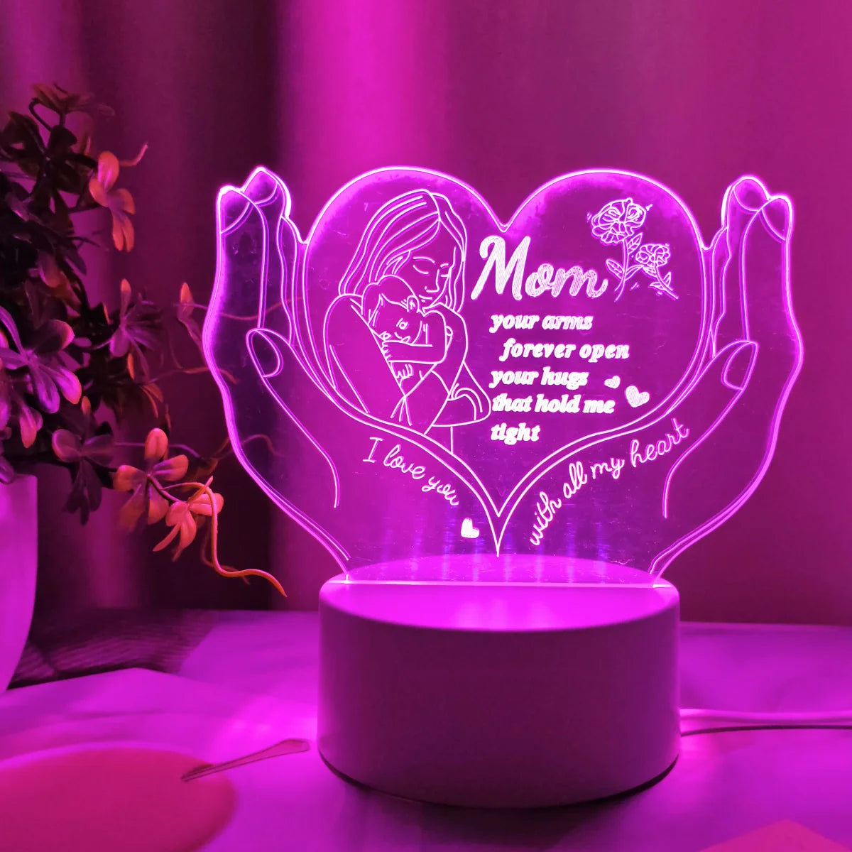 A glowing heart-shaped LED night light featuring a silhouette of a mother and text that reads I love you with all my heart.