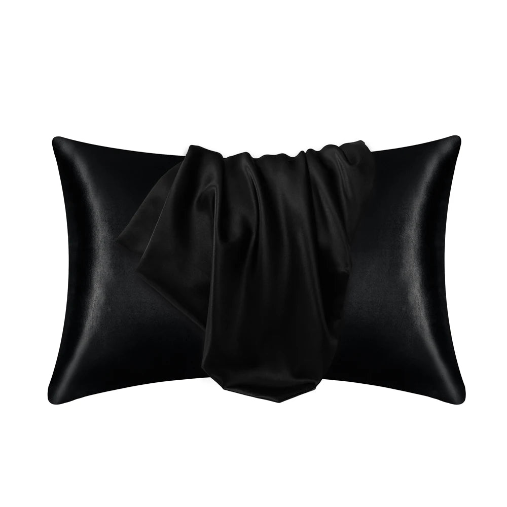 Black silky smooth satin pillowcase rolled and folded