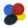 Three colored grit guard inserts for car wash buckets: blue, red, and yellow.