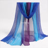A purple and blue sheer fabric playsilk draped in a vertical display.