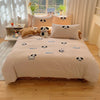 A beige duvet cover set featuring embroidered cartoon dogs on a bed with sheer curtains and a window view.