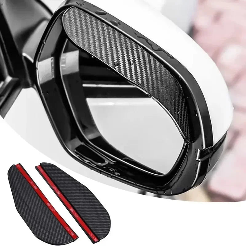 Close-up view of a black carbon fiber car side mirror rain and sun visor with red accents.