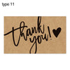 A brown greeting tag with the text thank you written in black script and a black heart symbol.