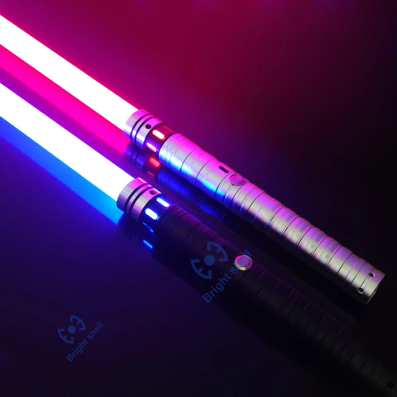 An RGB metal lightsaber with a glowing pink and blue blade is shown against a dark background.