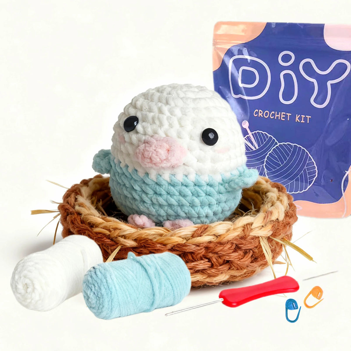A beginner crochet kit featuring a cute white animal project, yarn balls, and a purple packaging bag.