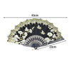 Black folding fan with white and gold lace trim and decorative patterns
