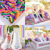 A colorful ball pit filled with plastic balls for kids, featuring bright colors like pink, green, yellow, and purple.