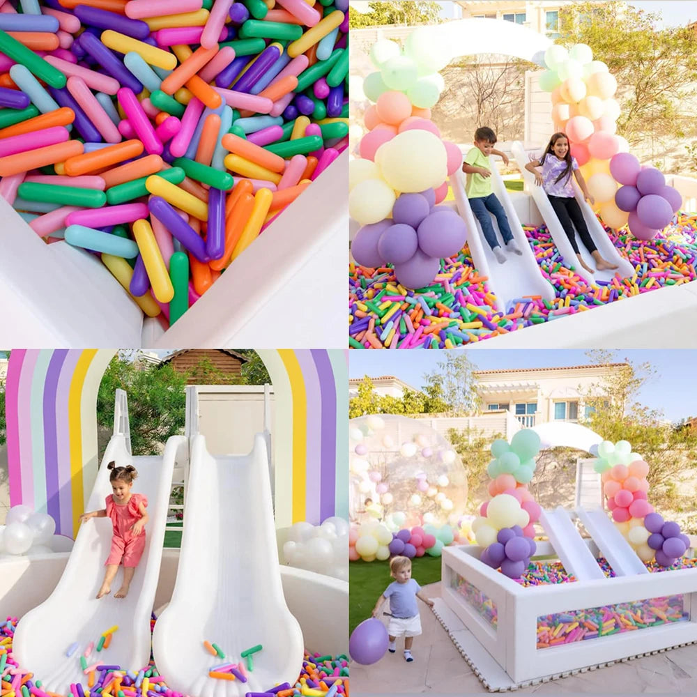 A colorful ball pit filled with plastic balls for kids, featuring bright colors like pink, green, yellow, and purple.