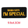 Black embroidered iron-on letter patch with yellow text that reads Mama Says I'm Special