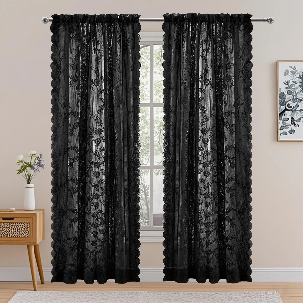 Black vintage floral lace sheer curtains in two panels hanging in a window frame.