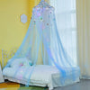 A bed curtain featuring a sheer blue fabric and LED lights, creating a canopy over a bed.