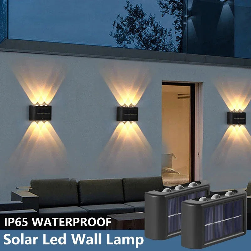An IP65 waterproof solar LED wall lamp mounted on a white exterior wall, illuminating the area.