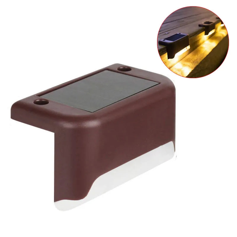 A rectangular, dark brown solar deck light with a glass panel and an illuminated beam shown next to a close-up of its functio