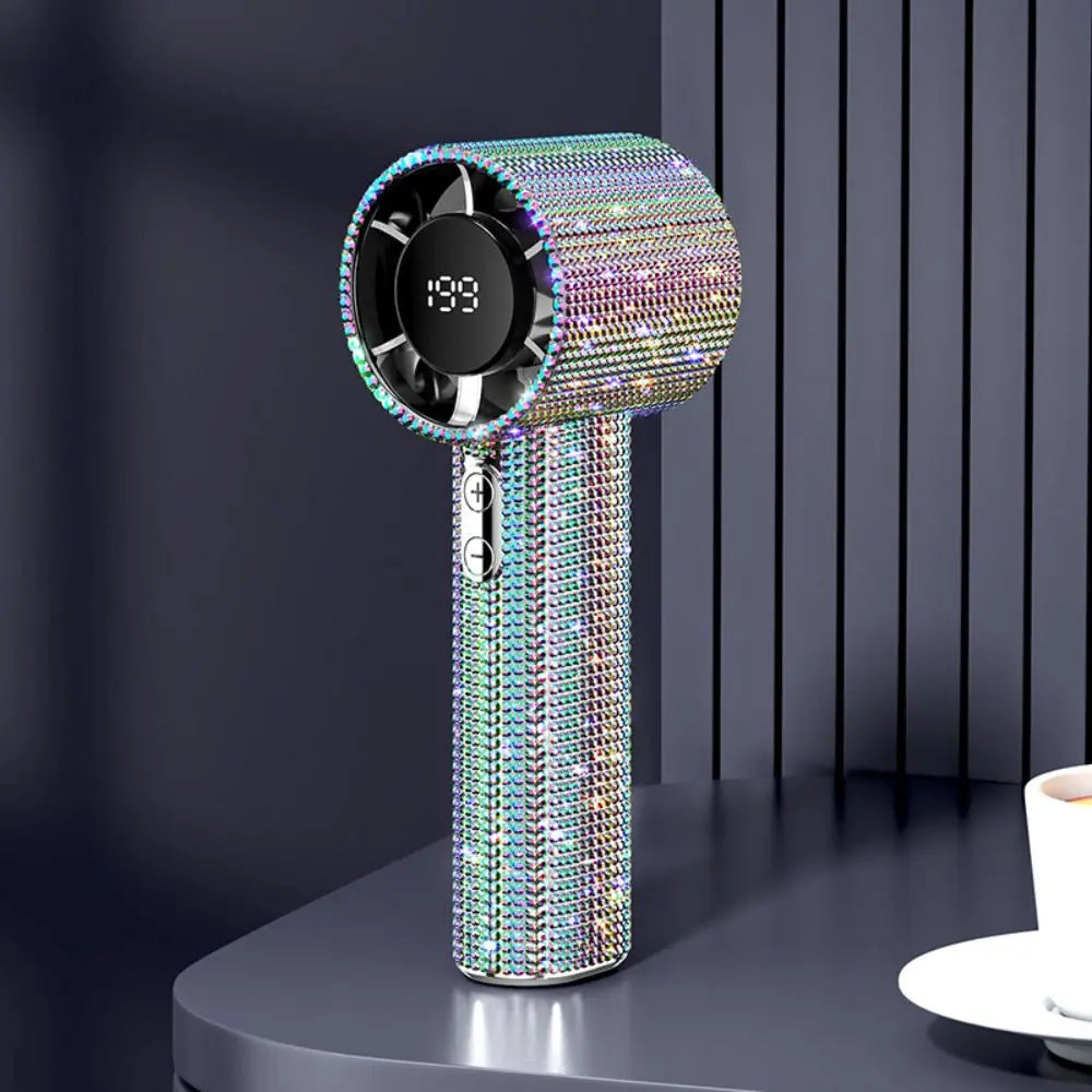 A sparkling diamond pattern portable fan with an LED glow, featuring a circular grille and a vertical body.