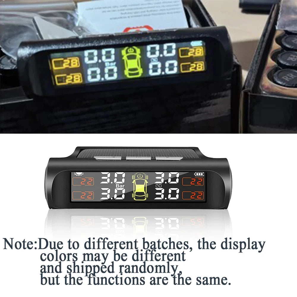 A black digital tire pressure monitor display showing pressure readings and a yellow sensor.
