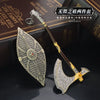 A detailed metal sword keychain and collectible ornament is displayed on a dark box.