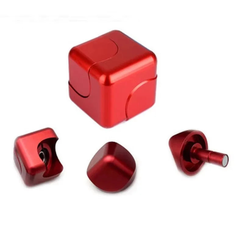 A red metal fidget spinner cube used for stress relief.