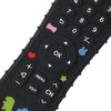 Close-up view of a black silicone baby teether toy with various buttons and shapes on the surface