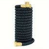 Black expandable telescopic garden hose with brass fittings coiled for storage
