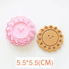 Pink and tan silicone cookie cutters featuring floral and sun designs for baking