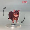 Three acrylic ornaments featuring a cat in various poses mounted on a clear circular base.