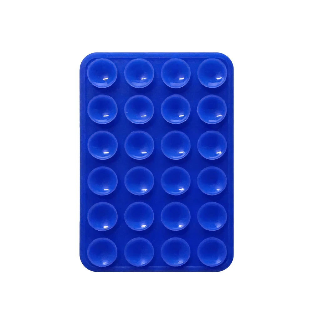 A blue silicone suction pad with multiple circular indentations for phone mounts.