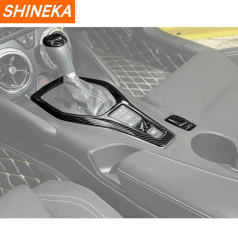 Carbon fiber interior trim kit for a Chevrolet Camaro showing a steering wheel and dashboard area.
